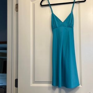 RE:NAMED. Vibrant blue slip dress with corset bust detail and criss-cross straps